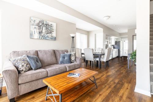 a living room with a couch and a table at Luxury Downtown Townhome Private Garage Unit 16 in Cleveland