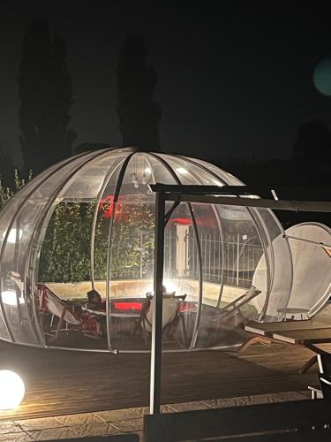 a helicopter in a glass dome at night at VILLA PATTY ASSISI con SPA in Assisi