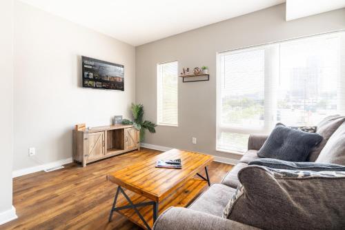 a living room with a couch and a coffee table at Luxury Downtown Townhome Private Garage Unit 16 in Cleveland
