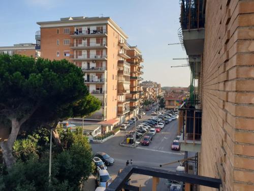 a view of a city street with parked cars at Appartamento Centrale Ladispoli in Ladispoli