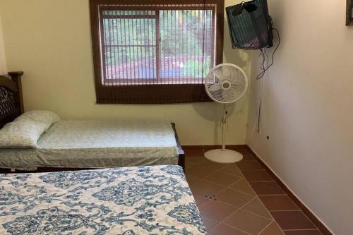 Ένα ή περισσότερα κρεβάτια σε δωμάτιο στο Casa Quinta con piscina privada - Luxury