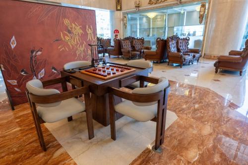 a room with a chess board on a table with chairs at T Hotel in Taichung