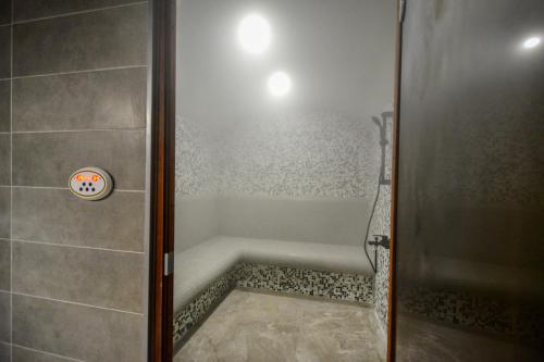 a shower in a bathroom with a shower stall at Hit Hot House in Sandanski