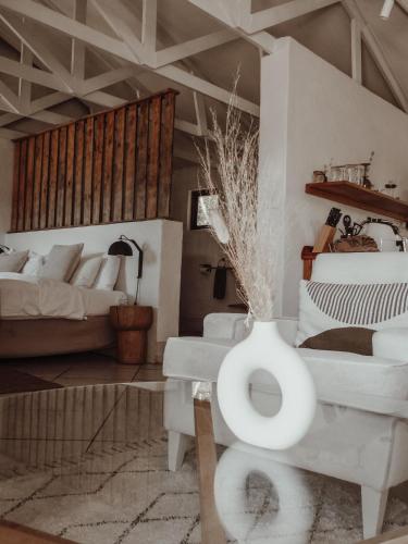 a living room with a couch and a table at Stanley Island in Plettenberg Bay