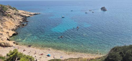 a group of people in the water at a beach at La Jungle Room in Rognac