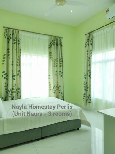 Katil atau katil-katil dalam bilik di NAYLA Homestay Perlis - Unit NAURA