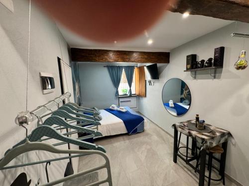 a hospital room with four beds and a mirror at La Casa di Jennifer nel centro in Parma