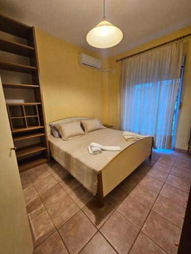 a bedroom with a bed in a room at KT Apartment in Drama