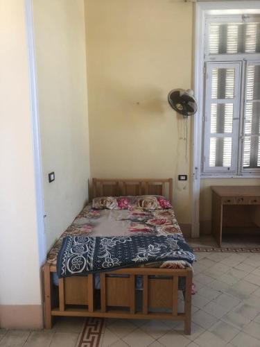 Ένα ή περισσότερα κρεβάτια σε δωμάτιο στο Saint Rita Guest House Alex