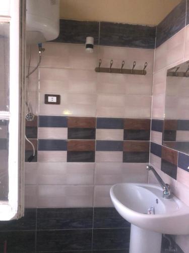 Ένα μπάνιο στο Saint Rita Guest House Alex