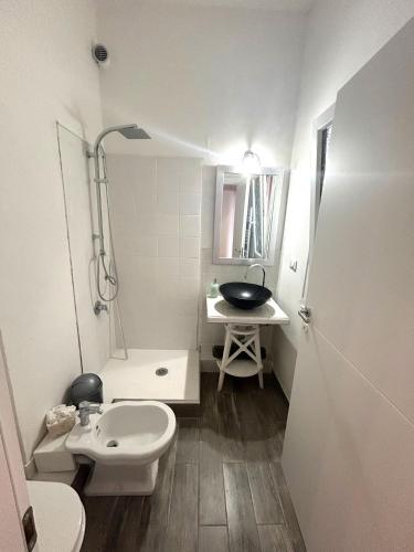 a small bathroom with a sink and a toilet at Family and view in Scandicci
