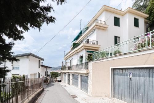 an empty street in front of a white building at -Terrazza Sul Mare- & Parcheggio Privato in Varazze