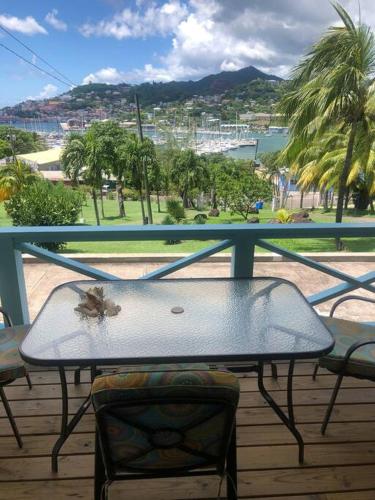 a insect sitting on a table on a balcony at CasaCalypso Grenada in Belmont