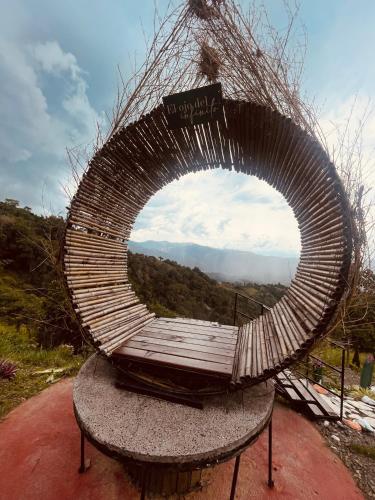 a sculpture of a circular object with a view at Entre Verdes Hotel & Glamping in Medellín