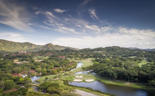 an aerial view of a river with golf courses at Carao T2-6 Luxury Penthouse Adults Only - Reserva Conchal in Playa Conchal