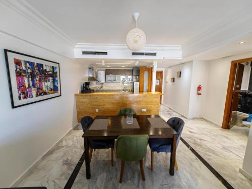 a dining room with a table and chairs at City Bleu Maroc in Tangier