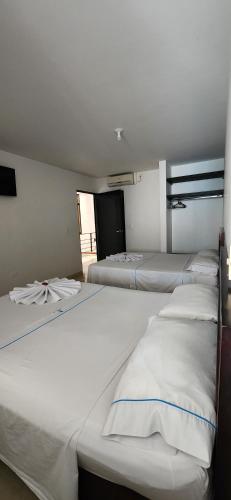 Una cama o camas en una habitación de Hotel Torres del Llano