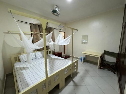 Кровать или кровати в номере JACARANDA HOMESTAY