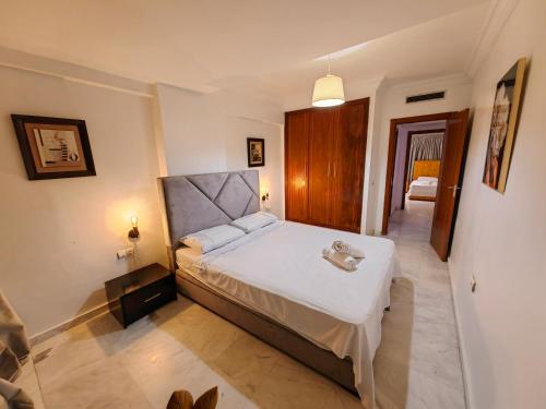 a bedroom with a large bed in a room at City Bleu Maroc in Tangier