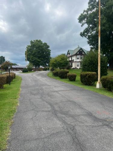 an empty road in front of a house at Potomac River Motel in Hancock