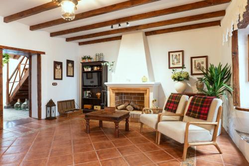 a living room with a couch and a fireplace at Home2Book La Casita del Muelle in Garachico