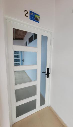 a room with a door with the number on it at Stefany's Lodging in Puerto Baquerizo Moreno