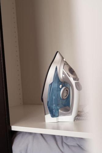 a faucet on a shelf in a refrigerator at Hemel Apartments - Riverside Retreat in Hemel Hempstead