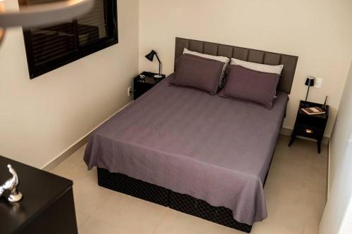 Ένα ή περισσότερα κρεβάτια σε δωμάτιο στο Loft Encantador Centro