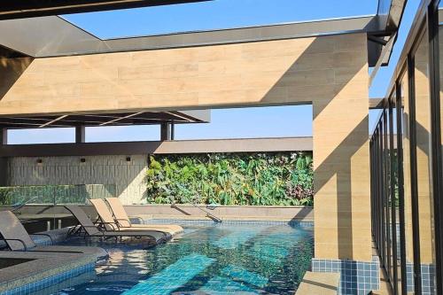 Πισίνα στο ή κοντά στο Loft Encantador Centro
