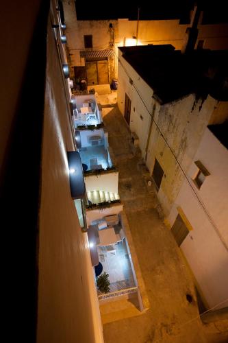 an overhead view of a building with tables and chairs at Appartamento Trifoglio TS Residence in Sannicola