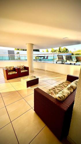 a room with a view of the ocean on a building at Studio 1304 Estilo e bem-estar no Cariri in Juazeiro do Norte