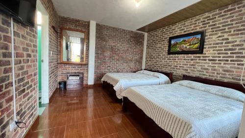 Postel nebo postele na pokoji v ubytování Hotel Paraíso Moniquira