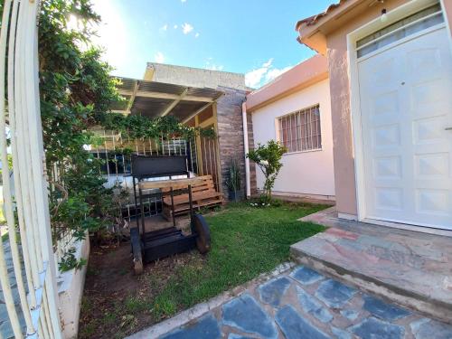 a backyard with a garage door and a house at LapuntaNita home in La Punta
