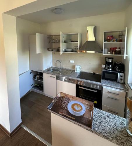 a kitchen with a sink and a counter top at Annie's apartment in Rakovica