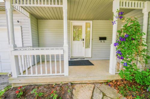 a front porch of a house with a white door at Lake Simcoe 4 Bedroom Family Home Ideal Toronto Area Retreat in Innisfil