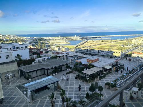 an aerial view of a city with buildings and the ocean at City Bleu Maroc in Tangier