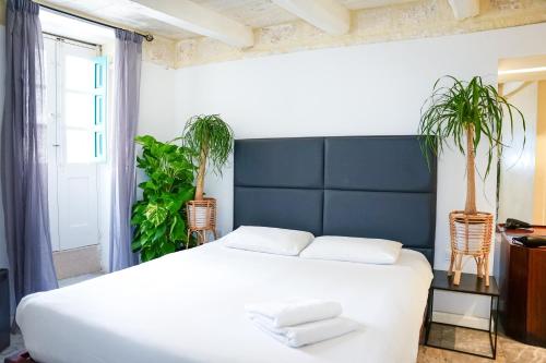 Cama o camas de una habitación en Valhalla Boutique Hotel