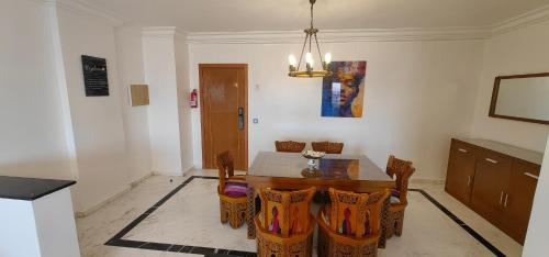 a dining room with a table and chairs at City Bleu Maroc in Tangier