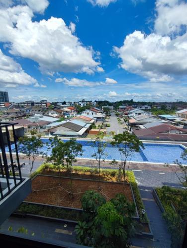 a view of a city from a balcony at Kuching Near GalaCity Armadale Residence Apartment in Kampong Tabuan