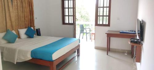 TV a/nebo společenská místnost v ubytování Pebbles Guesthouse