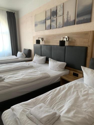 Ένα ή περισσότερα κρεβάτια σε δωμάτιο στο Hotel Bee Fang