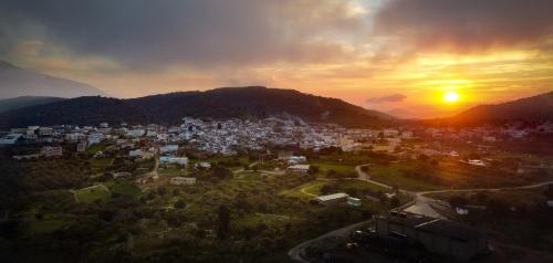 an aerial view of a city at sunset at Eve's house in Mokhós
