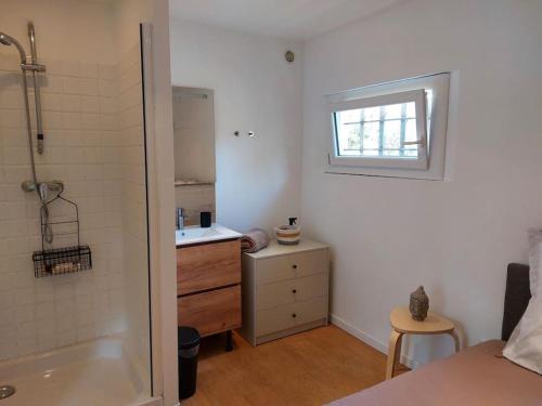 a bathroom with a shower and a sink and a tub at Maisonnette au cœur de la nature in Néoules