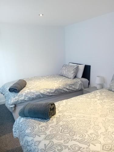 Ένα ή περισσότερα κρεβάτια σε δωμάτιο στο Windies apartment 4