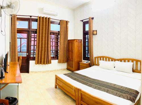 Postel nebo postele na pokoji v ubytování Chào Hotel Mũi Né
