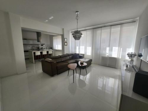 a living room with a couch and a table at Apartmán Julie in Loket