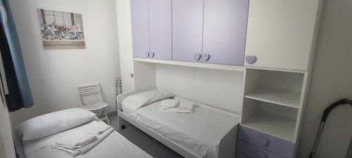 Posteľ alebo postele v izbe v ubytovaní Donna Beatrice aMare beach house