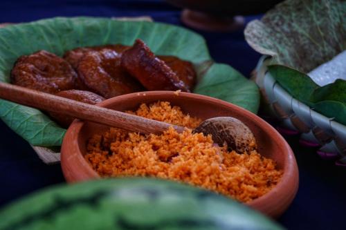a bowl of food with a bowl of fried foods at Rana Treehouse in Piduragala