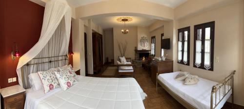 Ένα ή περισσότερα κρεβάτια σε δωμάτιο στο Guesthouse Filokalia