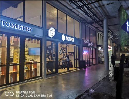 a store front of a building at night at Duplex 3R2B Eclipse Residence in Cyberjaya